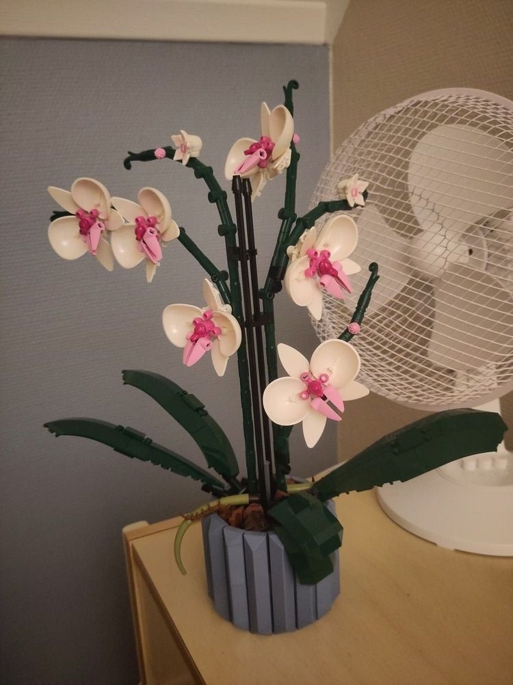 Image of a LEGO Orchid I built while I was in rehabilitation, which has more complex pieces than the classic rectangular LEGO blocks.